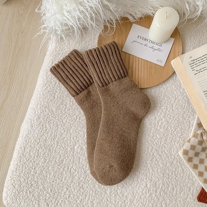 A pair of Beige Hushwoven socks with a fold-over ribbed cuff